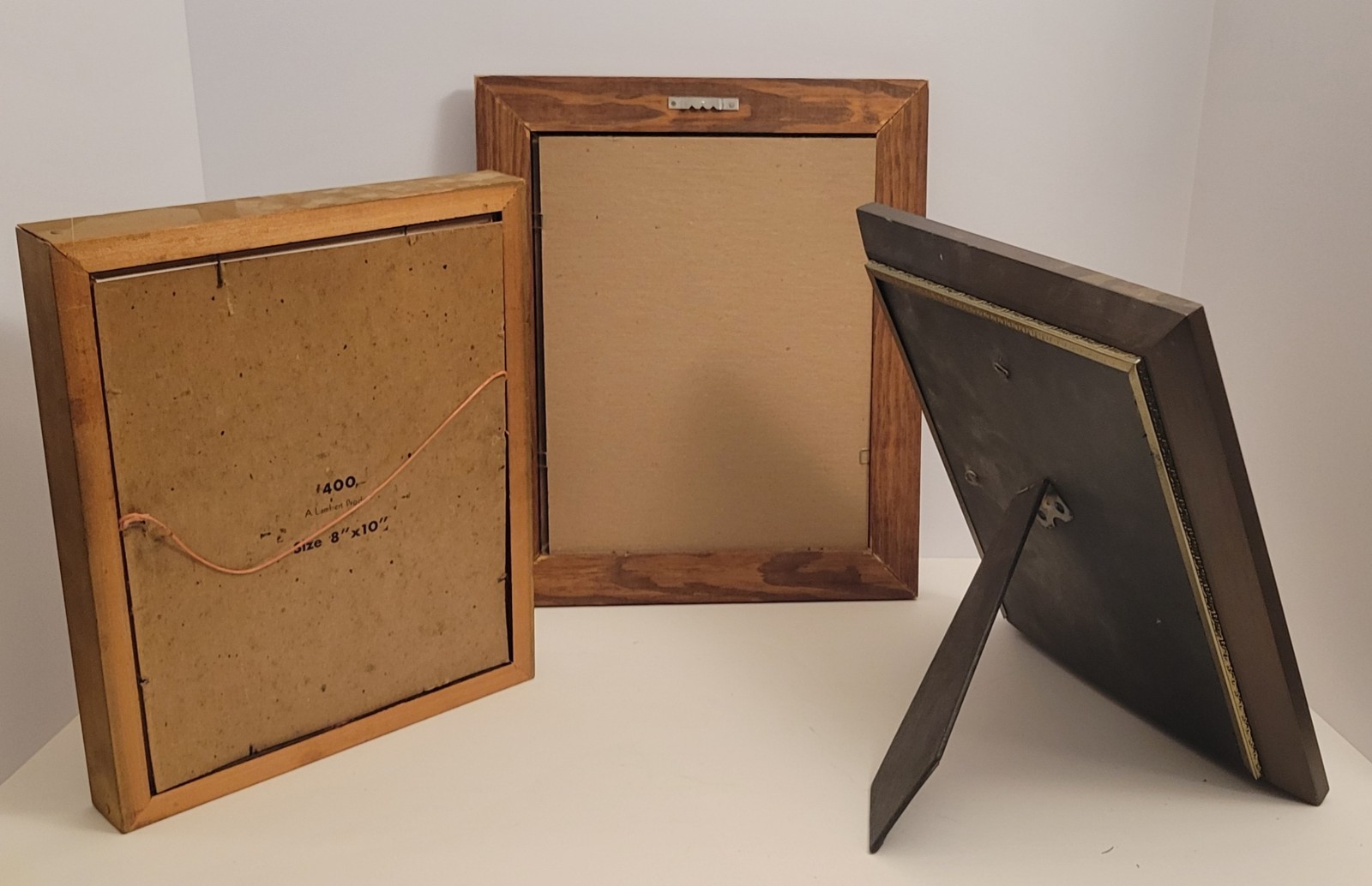Three heavy wooden picture frames. Various styles, see photos.