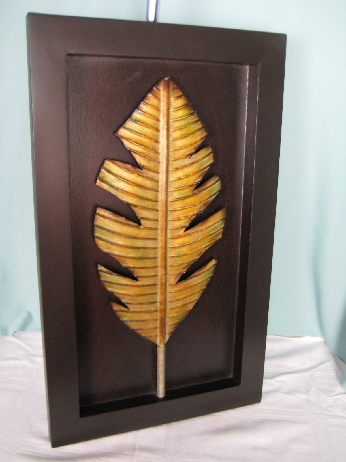 Black Recessed Wood Frame Brushed Gold leaf Displayed in Center Metal wood 20 in