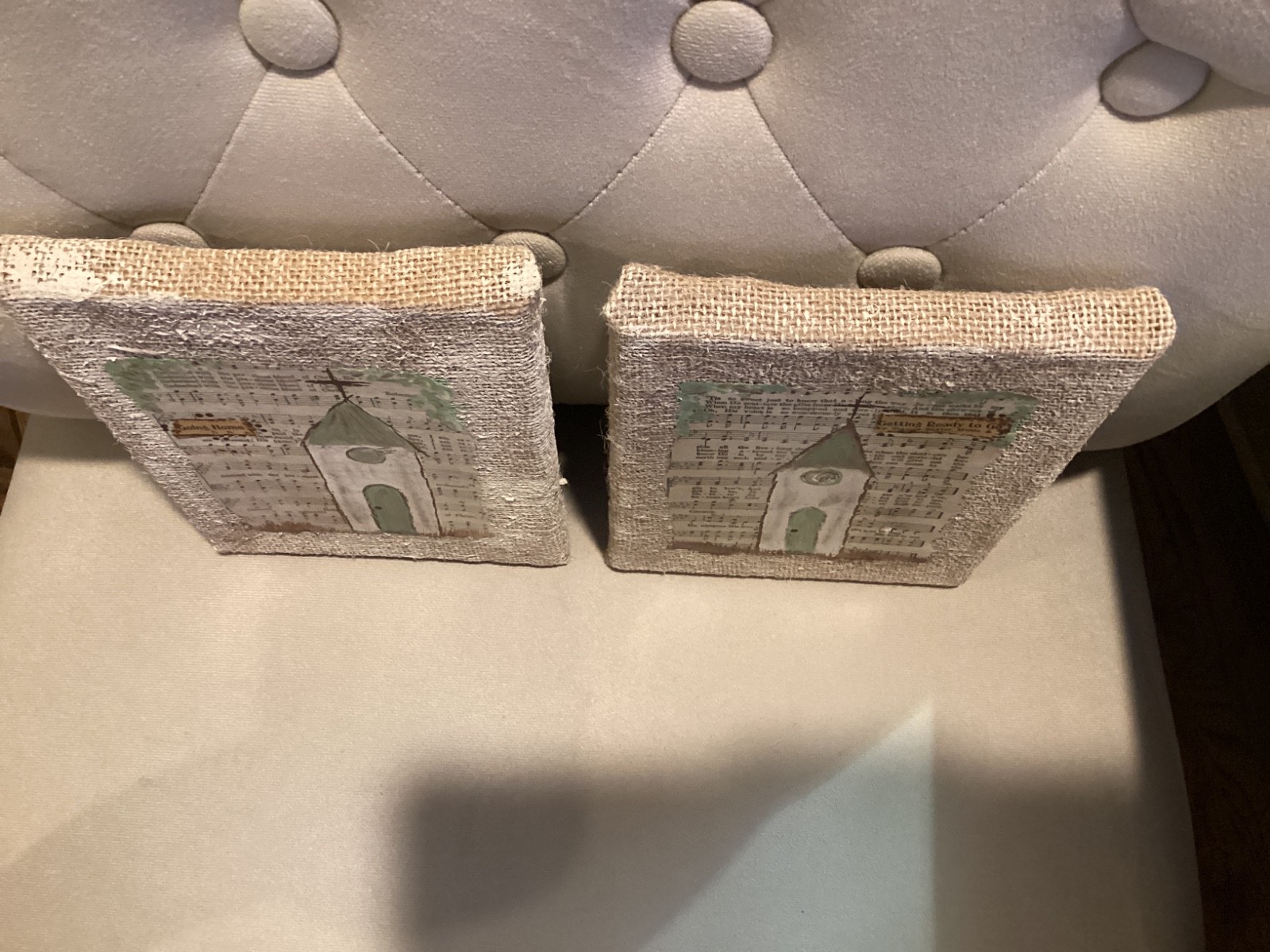Set of burlap wrapped pictures of churches painted on hymn pages 6” x 8”