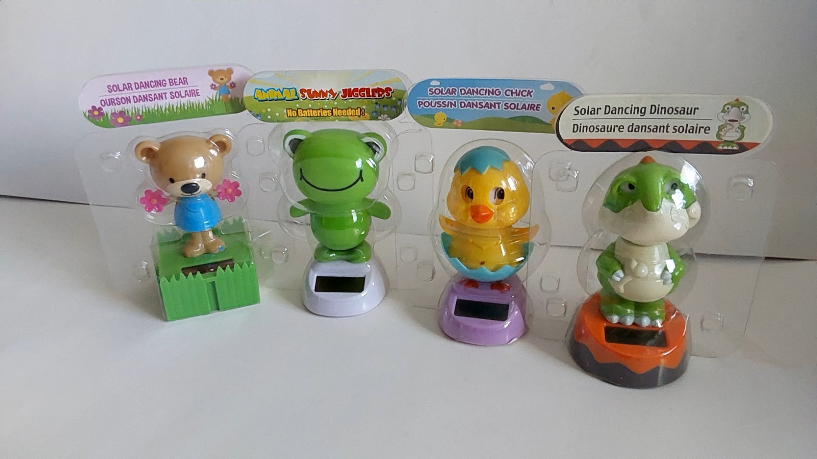 Solar Dancing Figures, Dino, Bear, Frog And Chick. Dance Exposed To Sunlight