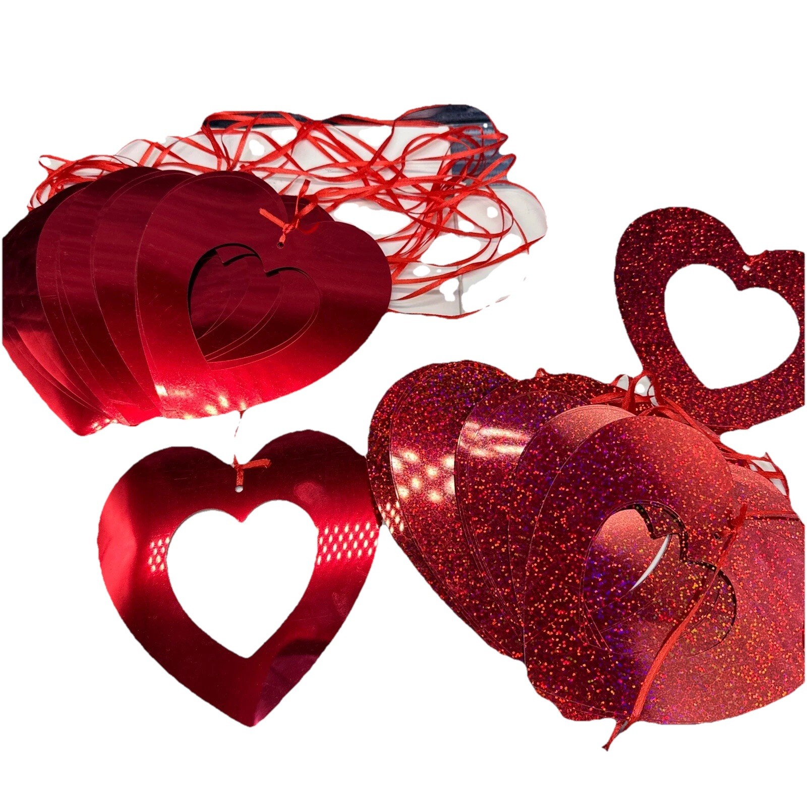 (16) Glitter hanging hearts 6” (13) chrome style hanging hearts. 6”