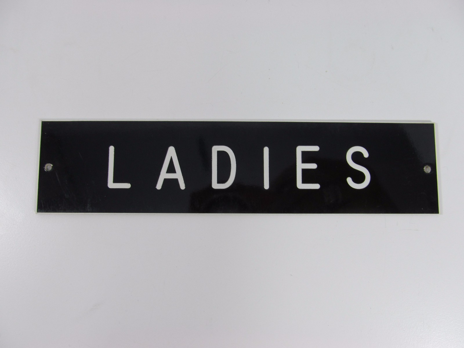 LADIES SIGN/PLAQUE WALL OR DOOR MOUNTED BLACK PLASTIC 8&Prime; X 2&Prime;