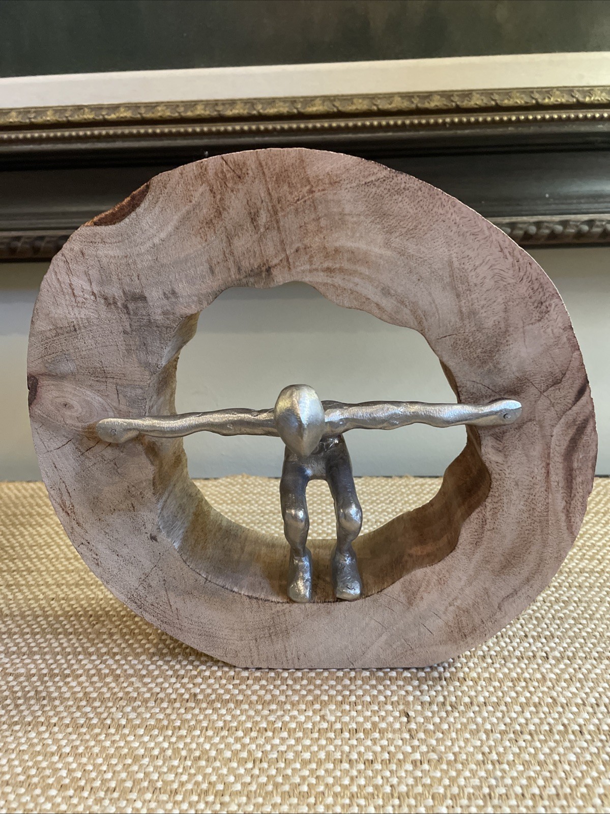 Art Metal Person In Wooden Circle Taking The Plunge