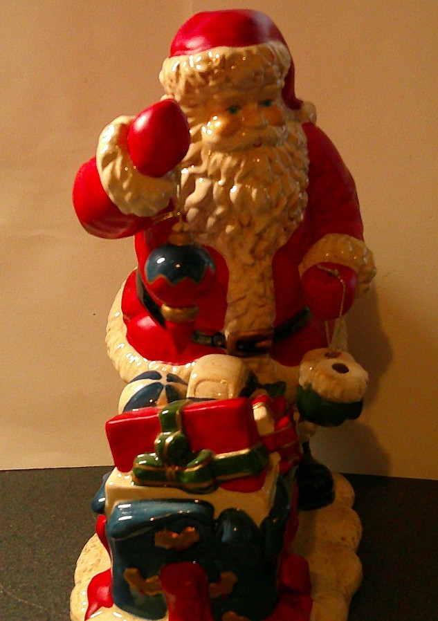 Santa Clause standing around presents with ornament 11 in. tall Ceramic figure