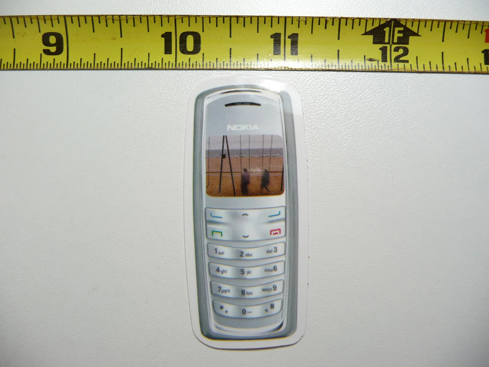 RETRO COUPLE ON SWING SET SMALL STICKER DECAL SCREEN IMAGE OLD CELL PHONE