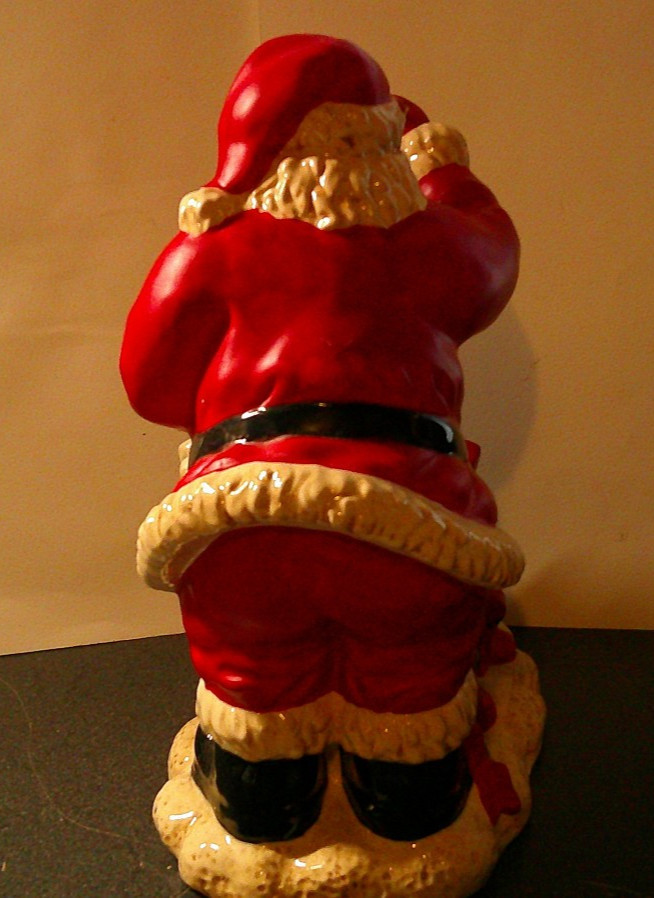 Santa Clause standing around presents with ornament 11 in. tall Ceramic figure