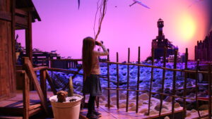 Une jeune fille observe le phare dans Imaginarium #2